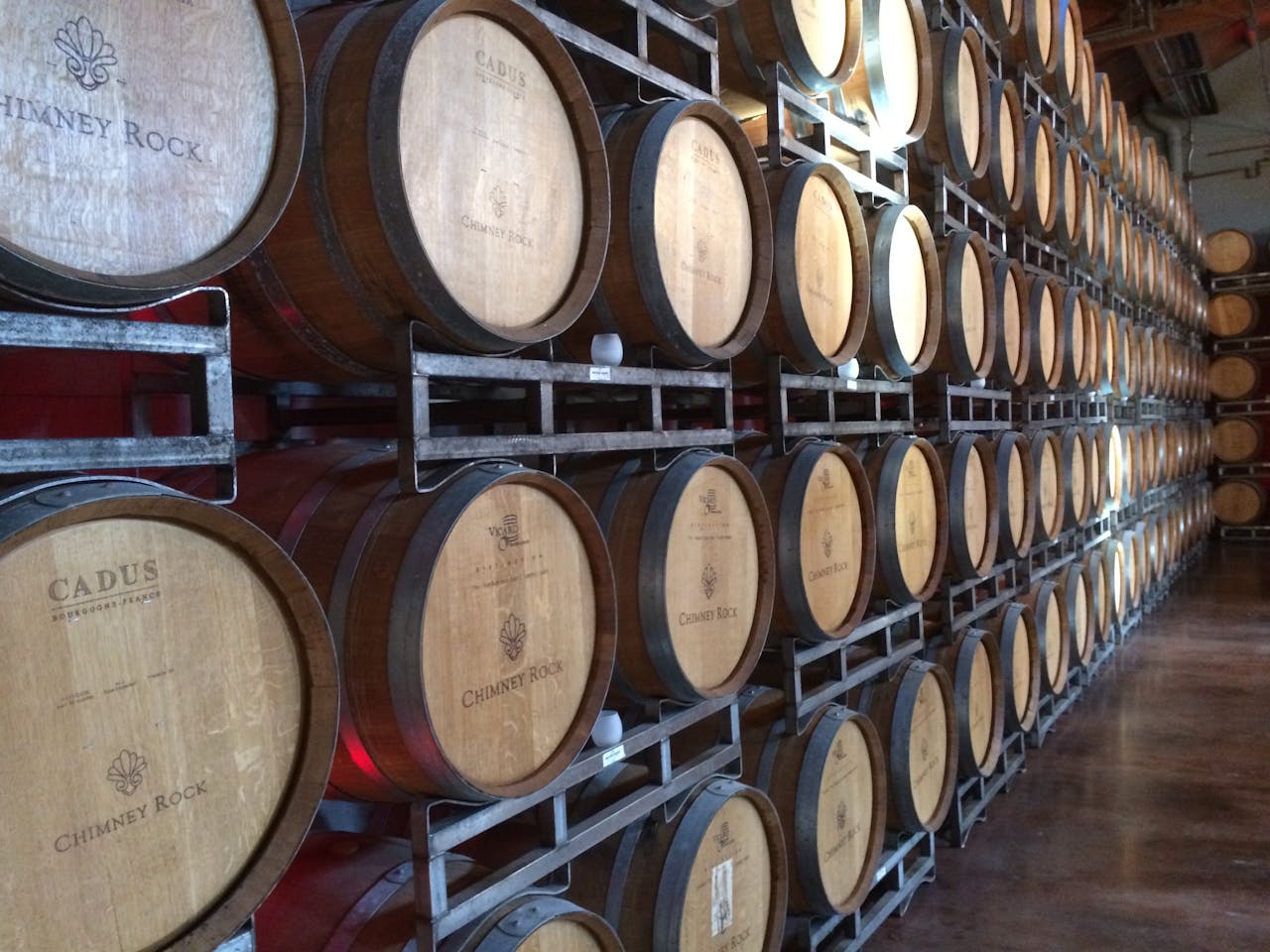 about-04 Wooden wine barrels in a Napa, CA winery, ideal for wine production visuals.
